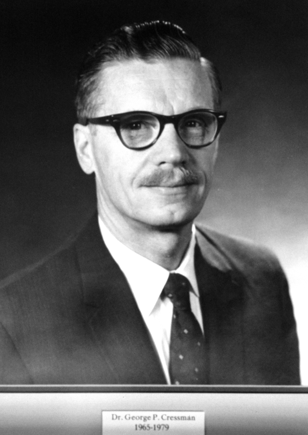 George Parmley Cressman (1919-2008), first Director of the Joint Numerical Weather Prediction Unit. Trained under Carl-Gustaf Rossby at the University of Chicago, he led the JNWPU from 1954 to 1964 and later headed the National Weather Service. NOAA portrait, public domain.