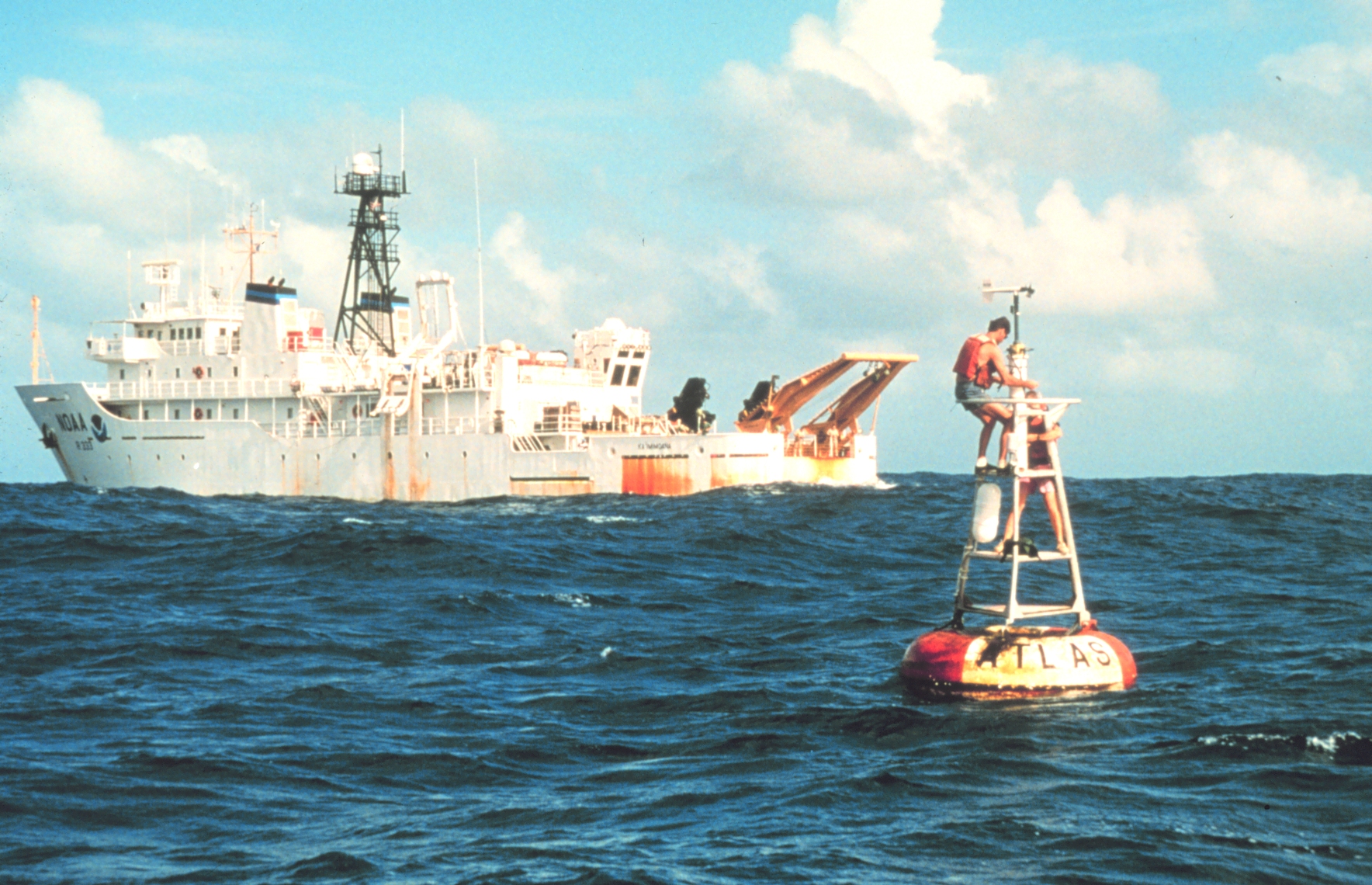 A TAO/TRITON ocean-atmosphere mooring being serviced in the tropical Pacific. Ninety of these moorings, deployed across the equatorial Pacific from the 1980s onwards, give real-time measurements of the ocean temperature and wind that power modern El Nino forecasts. The system was built in direct response to Bjerknes's theoretical framework and the 1982-83 El Nino that made that framework publicly urgent. Photo: NOAA, public domain.